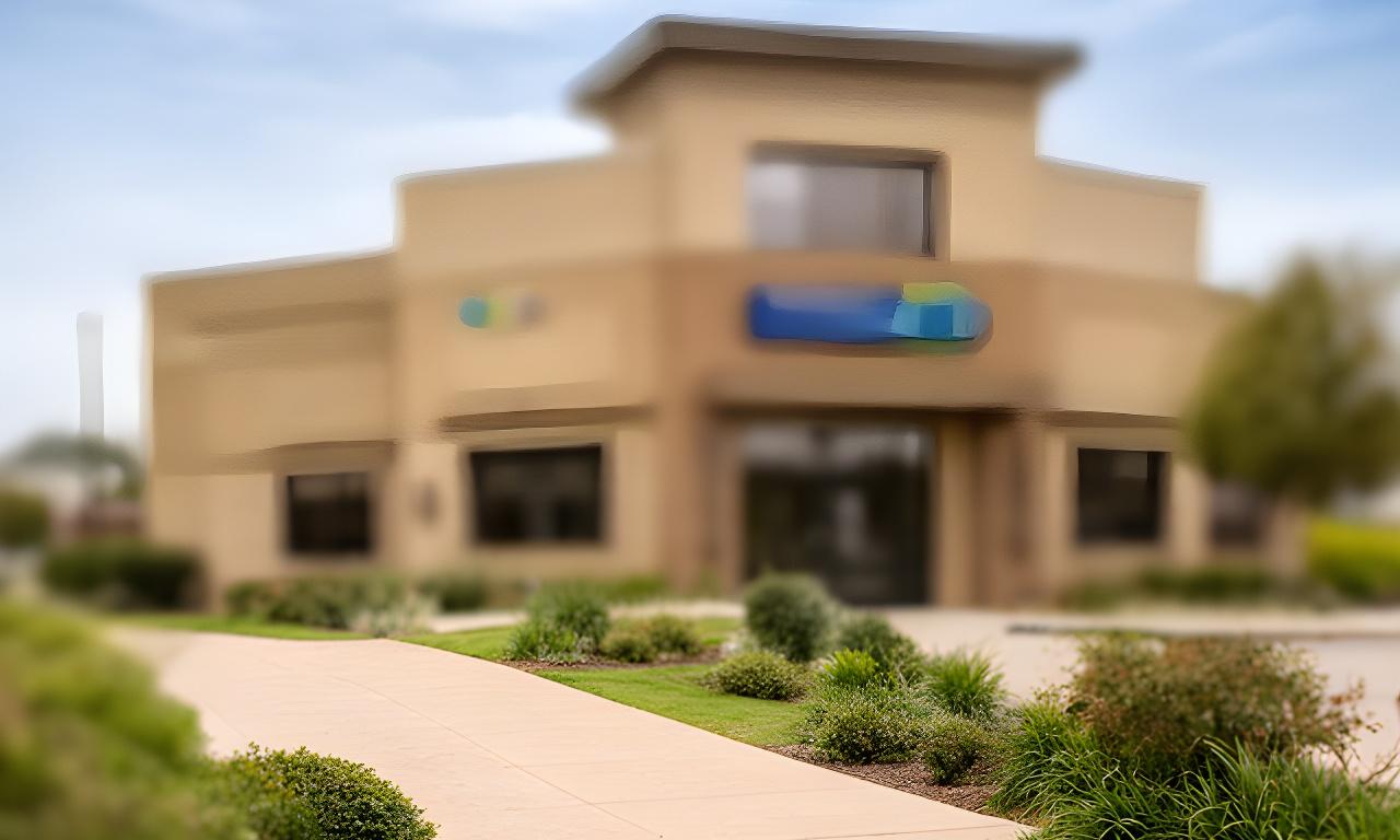 Exterior view of a professional office building in Hartselle with clear signage and a tidy walkway